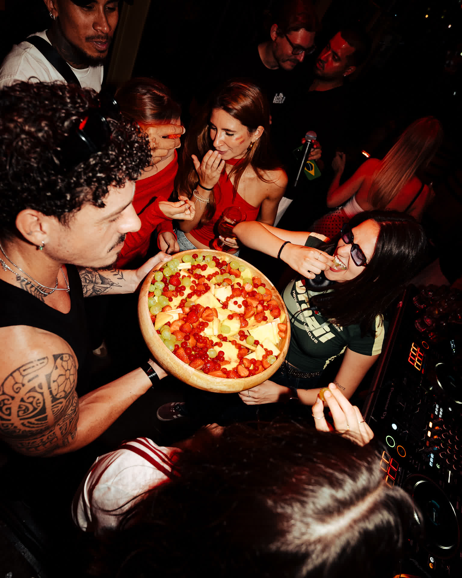 Sharing pizza on the dancefloor at a Gasolina Social Club night